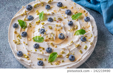 Rustic No Bake Mascarpone Cheesecake Topped With Blueberries Pistachios Maple Syrup And Mint Rustic No Bake Mascarpone Cheesecake Topped With Blueberries Pistachios Maple Syrup And Mint 142219490