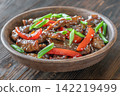 Chinese Beef Stir Fry Garnished With Scallions Sesame Seeds And Chopsticks Beautifully Presented 142219499