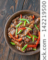 Chinese Beef Stir Fry Garnished With Scallions Sesame Seeds And Chopsticks Beautifully Presented 142219500