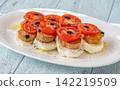 Elegant Caprese salad with mozzarella tomatoes king oyster mushrooms balsamic olive oil appetizer platter 142219509