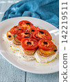 Elegant Caprese salad with mozzarella tomatoes king oyster mushrooms balsamic olive oil appetizer platter 142219511