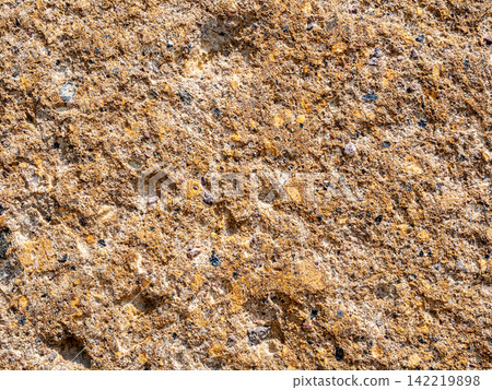 old wall from orange armenian tuff stone close-up old wall from orange armenian tuff stone close-up 142219898