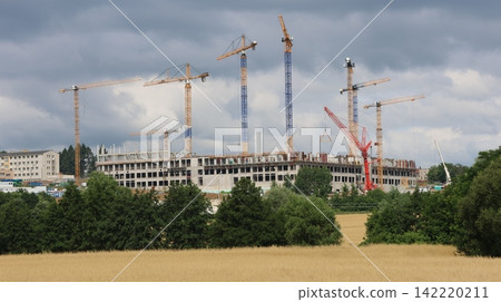 Large construction site with multiple tower cranes of the new military hospital in Presov Large construction site with multiple tower cranes of the new military hospital in Presov 142220211