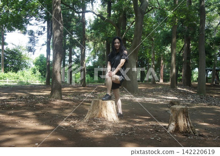 Tall woman playing in the park Tall woman playing in the park 142220619