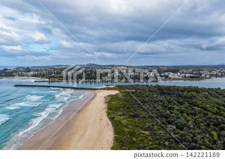 Aerial view from North Shore looking across the Hastings River entrance towards Town Beach, the breakwall and caravan park in Port Macquarie, with the Pacific Ocean and surrounding coastal landscape Aerial view from North Shore looking across the Hastings River entrance towards Town Beach, the breakwall and caravan park in Port Macquarie, with the Pacific Ocean and surrounding coastal landscape 142221189