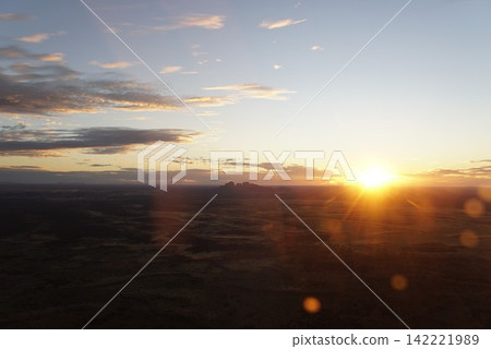 Sunset view of Uluru-Kata Tjuta National Park from a helicopter, Australia Sunset view of Uluru-Kata Tjuta National Park from a helicopter, Australia 142221989