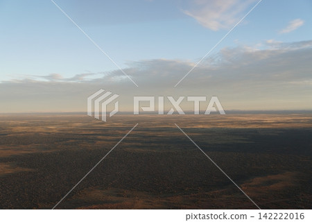 Sunset view of Uluru-Kata Tjuta National Park from a helicopter, Australia Sunset view of Uluru-Kata Tjuta National Park from a helicopter, Australia 142222016
