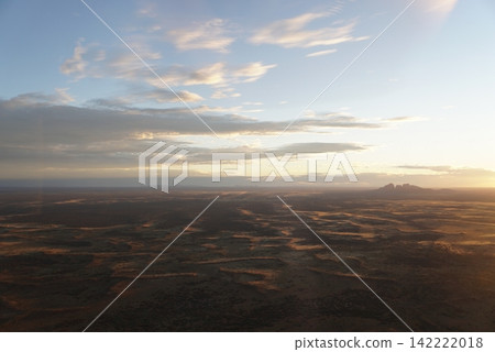 Sunset view of Uluru-Kata Tjuta National Park from a helicopter, Australia Sunset view of Uluru-Kata Tjuta National Park from a helicopter, Australia 142222018