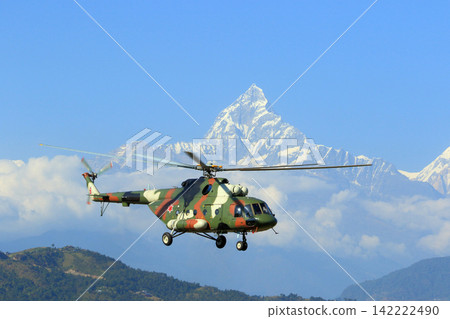 Annapurna mountain range and Nepal Army Air Forces Mi-17V-5 Annapurna mountain range and Nepal Army Air Forces Mi-17V-5 142222490