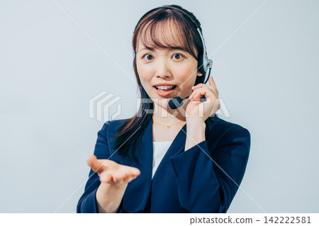 A female operator wearing a headset. A female operator wearing a headset. 142222581