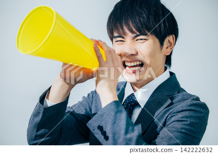 A businessman supporting megaphone A businessman supporting megaphone 142222632