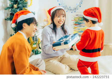 Parents and children enjoying Christmas party Parents and children enjoying Christmas party 142223731