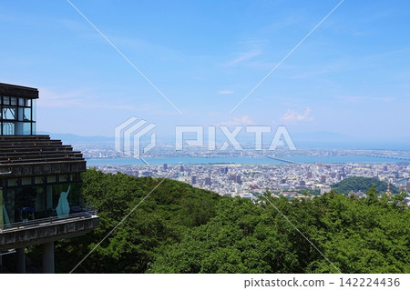 A panoramic view of Tokushima city and the Seto Inland Sea from the summit of Mount Bizan, the symbol of Tokushima City. A panoramic view of Tokushima city and the Seto Inland Sea from the summit of Mount Bizan, the symbol of Tokushima City. 142224436
