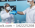 Two caucasian scientist men woman fist bump team partner shake hands together. Teamwork two scientist science chemistry research in laboratory. Close up hands pharmaceutical science team partnership 142225208