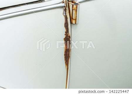Rust and scratches on a car Rusty iron plate of an old car Rust and scratches on a car Rusty iron plate of an old car 142225447
