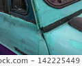 Rust and scratches on a car Rusty iron plate of an old car 142225449