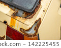 Rust and scratches on a car Rusty iron plate of an old car 142225455