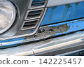 Rust and scratches on a car Rusty iron plate of an old car 142225457
