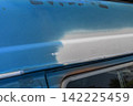 Rust and scratches on a car Rusty iron plate of an old car 142225459