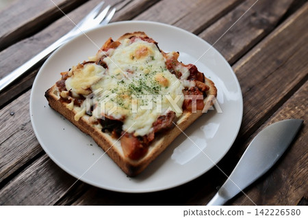 Pizza toast made with leftover eggplant and meat sauce from pasta. 142226580