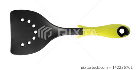 Plastic cooking spatula with multiple drainage holes for lifting and turning food isolated on a white background Plastic cooking spatula with multiple drainage holes for lifting and turning food isolated on a white background 142226761