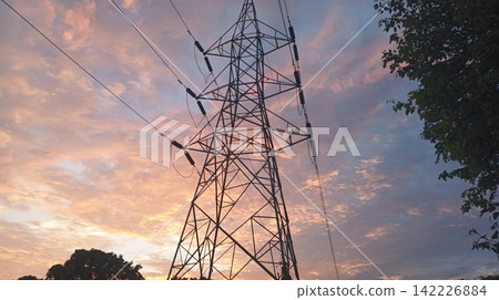 high voltage power lines at sunset dramatic clouds high voltage power lines at sunset dramatic clouds 142226884