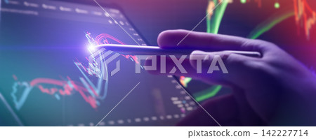 Precision in trading analysis. Hand using digital stylus pen to point at glowing candlestick stock market chart on screen. Precision in trading analysis. Hand using digital stylus pen to point at glowing candlestick stock market chart on screen. 142227714