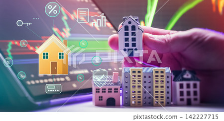 Property technology and smart real estate concept. Digital housing interface with security, loan, and interest rate holograms over laptop screen. Property technology and smart real estate concept. Digital housing interface with security, loan, and interest rate holograms over laptop screen. 142227715