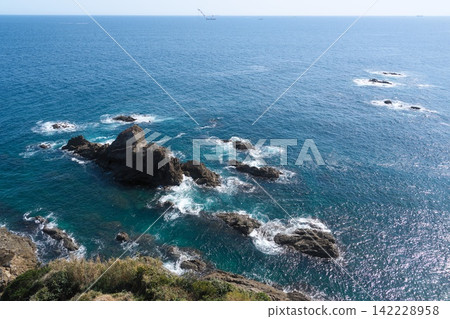 The coastline of Shima, Mie Prefecture, with its extensive rocky reefs and the ships offshore. The coastline of Shima, Mie Prefecture, with its extensive rocky reefs and the ships offshore. 142228958