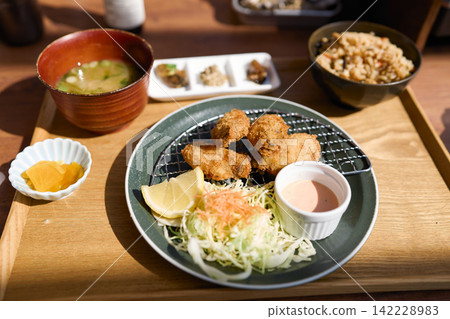 Oyster fry set meal: Japanese meal set with miso soup and seasoned rice. Oyster fry set meal: Japanese meal set with miso soup and seasoned rice. 142228983