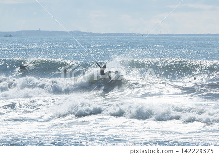 People surfing on the swells from a low-pressure system at Shonan Tsujido Beach. People surfing on the swells from a low-pressure system at Shonan Tsujido Beach. 142229375