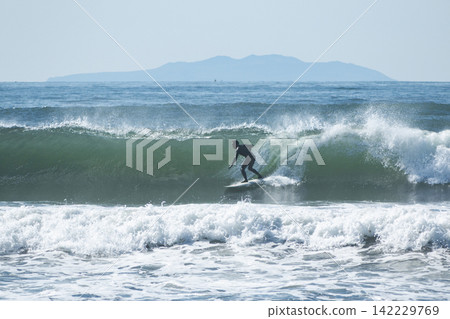 People surfing on the swells from a low-pressure system at Shonan Tsujido Beach. People surfing on the swells from a low-pressure system at Shonan Tsujido Beach. 142229769