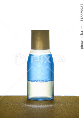 Two Layer Cosmetic Bottle With Blue Liquid Upper Chamber And Clear Lower Chamber Capped Two Layer Cosmetic Bottle With Blue Liquid Upper Chamber And Clear Lower Chamber Capped 142229981
