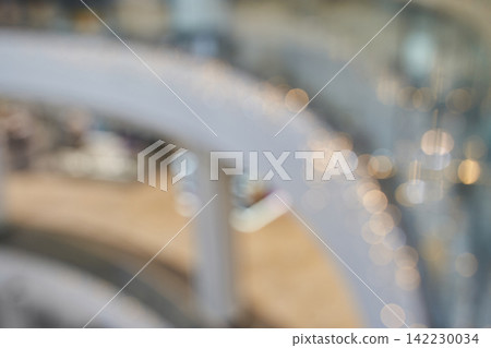 Spiral Staircase Railing Captured With Bokeh Lights In Soft Out Of Focus Interior Atrium Scene 142230034