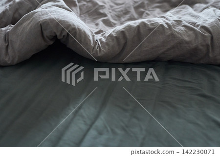 Duvet Partially Folded Bedroom Closeup Linen Sheet On Bed With Charcoal Fitted Sheet And Visible Duvet Partially Folded Bedroom Closeup Linen Sheet On Bed With Charcoal Fitted Sheet And Visible 142230071
