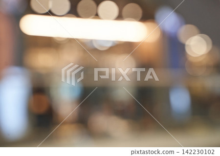Mall Interior Lights Blurred In Wide Shallow Focus With Bokeh Highlights And Indistinct Storefronts Mall Interior Lights Blurred In Wide Shallow Focus With Bokeh Highlights And Indistinct Storefronts 142230102