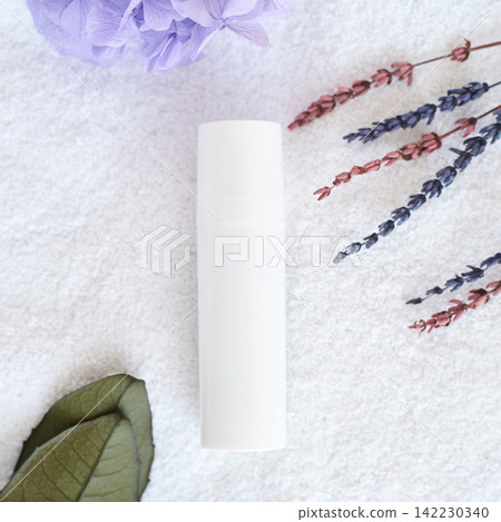White Cylindrical Bottle Lying On Textured Towel With Dried Lavender Sprigs Purple Hydrangea White Cylindrical Bottle Lying On Textured Towel With Dried Lavender Sprigs Purple Hydrangea 142230340