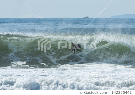 Shonan Tsujido Beach: Surfing on waves brought in by a low-pressure system. Shonan Tsujido Beach: Surfing on waves brought in by a low-pressure system. 142230441