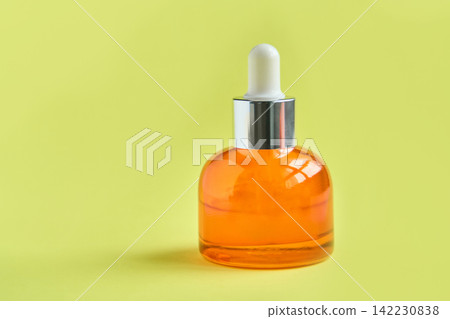 Amber Glass Dropper Bottle Standing On Yellow Backdrop Cosmetic Serum Container Upright Amber Glass Dropper Bottle Standing On Yellow Backdrop Cosmetic Serum Container Upright 142230838