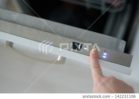 Hand Selecting Dishwasher Program On Illuminated Digital Control Panel Of Stainless Steel Drawer 142231106