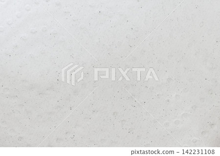 Paper Sheet Closeup Displaying Subtle Bumpy Embossing And Scattered Dark Specks On Pale Porous Paper Sheet Closeup Displaying Subtle Bumpy Embossing And Scattered Dark Specks On Pale Porous 142231108