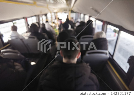 Commuting Passengers Seated In Crowded City Bus Interior During Morning Commute Rear View Blurred Commuting Passengers Seated In Crowded City Bus Interior During Morning Commute Rear View Blurred 142231177