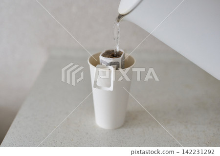 Kettle Pouring Water Into Cup Paper Pour Over Coffee Filter Brewing Inside White Disposable Cup 142231292