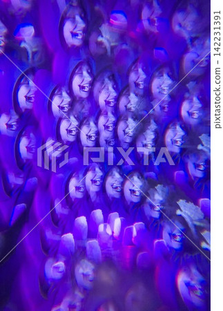 Woman Laughing Continuously In Vibrant Purple Kaleidoscope Inside Dark Lit Space With Dense Woman Laughing Continuously In Vibrant Purple Kaleidoscope Inside Dark Lit Space With Dense 142231391