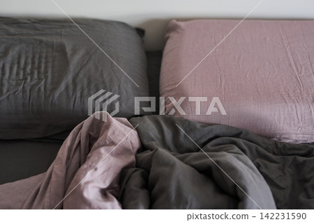 Pillows Rumpled Linen Bed Frontal Overhead View Of Paired Pink And Gray Pillows With Rumpled Duvet Pillows Rumpled Linen Bed Frontal Overhead View Of Paired Pink And Gray Pillows With Rumpled Duvet 142231590