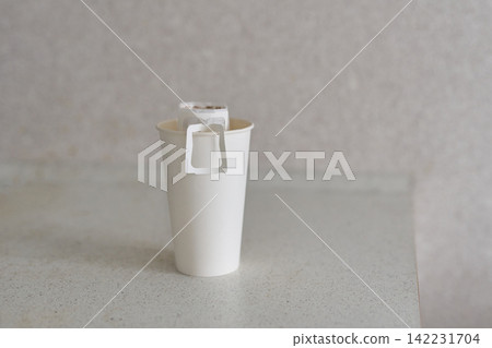 Cup Pour Over Coffee Filter Positioned In White Disposable Cup On Speckled Countertop Neutral Cup Pour Over Coffee Filter Positioned In White Disposable Cup On Speckled Countertop Neutral 142231704