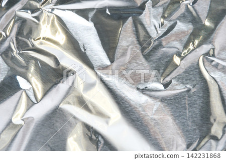 Crumpled Aluminum Foil Metallic Texture Background With Bright Silver Reflections For Decorative Crumpled Aluminum Foil Metallic Texture Background With Bright Silver Reflections For Decorative 142231868