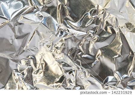 Shiny Crumpled Aluminum Foil Texture With Strong Reflections And Complex Fold Patterns For Silver Shiny Crumpled Aluminum Foil Texture With Strong Reflections And Complex Fold Patterns For Silver 142231929