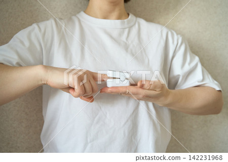 Hands Inserting Finger Into Pulse Oximeter Showing Oxygen Measurement Process And Healthcare 142231968