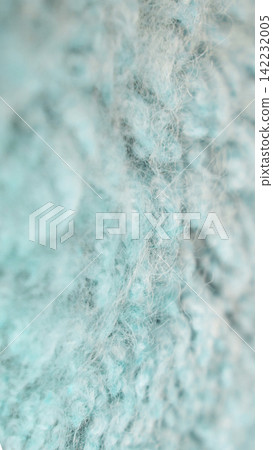Turquoise Wool Fabric In Soft Fuzzy Closeup Showing Detailed Yarn Fibers And Knit Structure Turquoise Wool Fabric In Soft Fuzzy Closeup Showing Detailed Yarn Fibers And Knit Structure 142232005